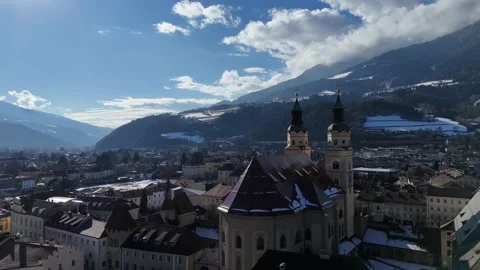 Vertical Drone Ascent from Stream Unveiling Cathedral and Bressanone wit Vídeo Stock 335736476
