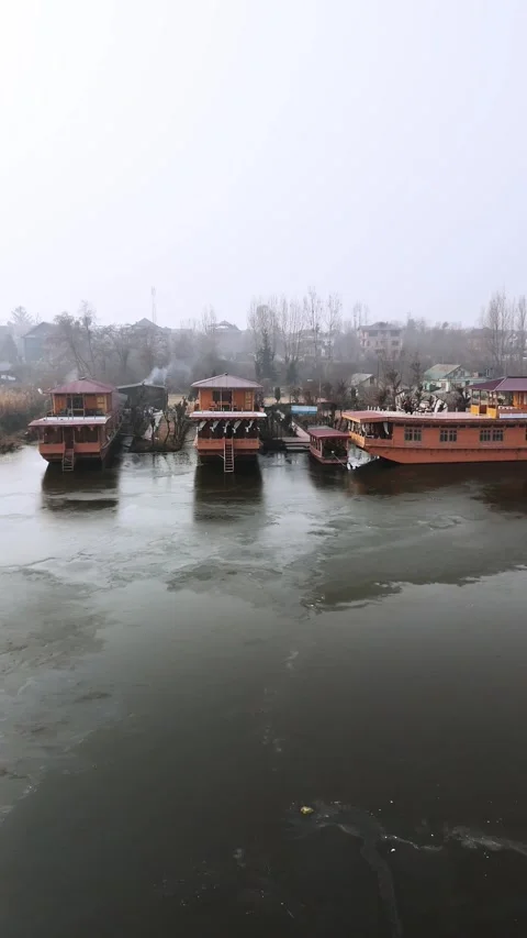 Vertical Drone beautifully capturing the winter freeze surrounding Nageen’s Stock Footage 311019530