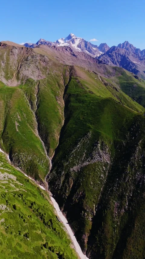 Vertical drone cinematically flying around mountains in Kazakhstan Stock Footage 345126307