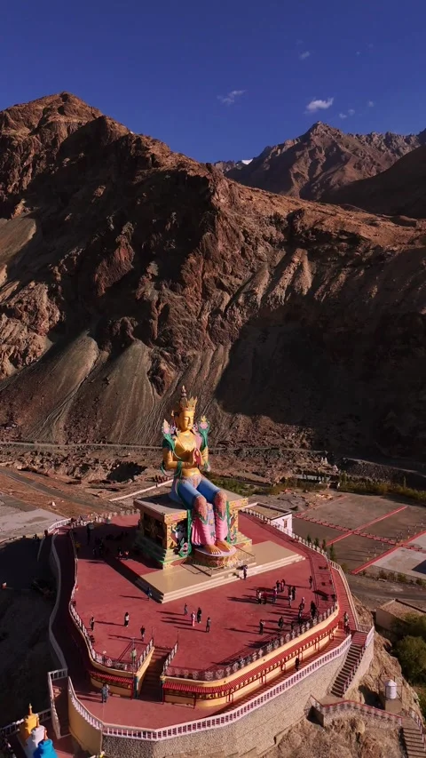Vertical drone circling the Maitreya Buddha statue towering above Nubra. Stock Footage 310901020