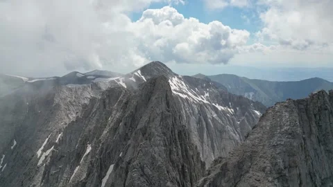 Vertical Drone Descent Between Mytikas and Stefani Peaks Through Alpine Clou Stock Footage 340322449