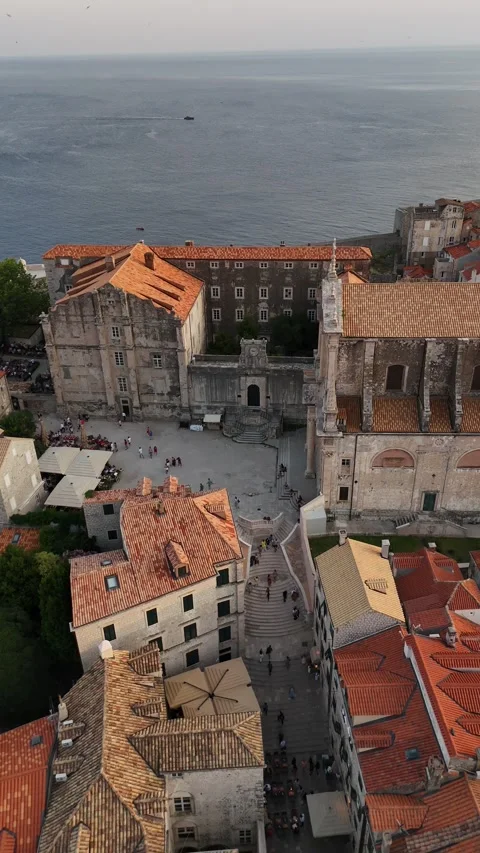 Vertical Drone Descent Over Dubrovnik Jesuit Stairs with Birds Flying Dusk 4K Vídeos de archivo 337850612