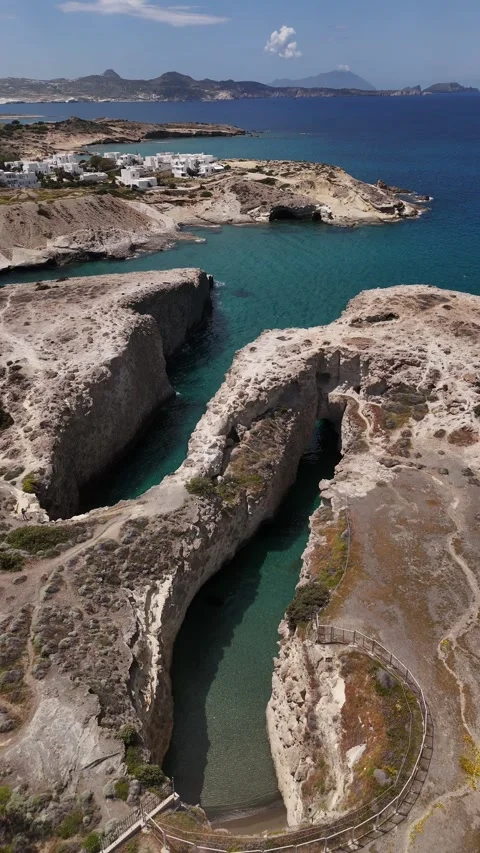 Vertical Drone Descent at Papafragas Sea Cave Channel in Milos Greece, 4K Stock Footage 337175284