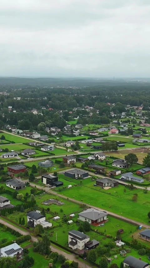 Vertical Drone Establishing Shot Over Residential Grid in Ikskile, Latvia With Stock Footage 318220895