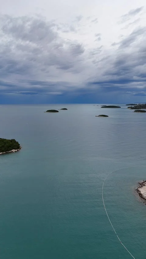 Vertical drone flight between small scenic sea islands Stock Footage 322045151