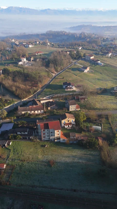 Vertical drone flight over Castro dei Volsci misty valley and village Video stock 328124448