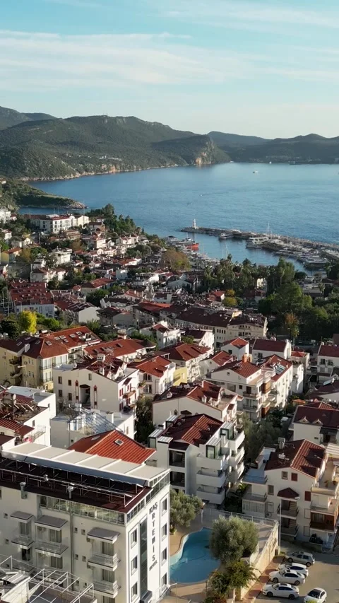 Vertical Drone Flight Over Kas Turkey Rooftops Toward the Sea Vídeo Stock 337832958