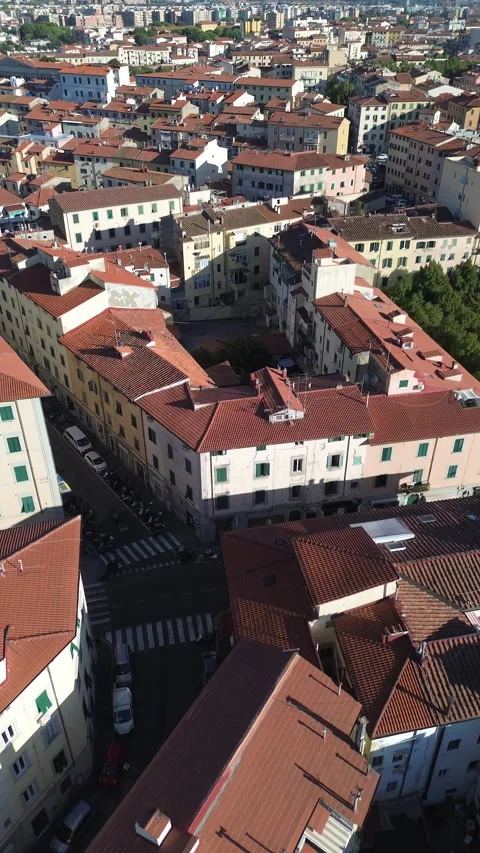 Vertical drone flight over old town rooftops, Livorno Italy Stock Footage 345134716