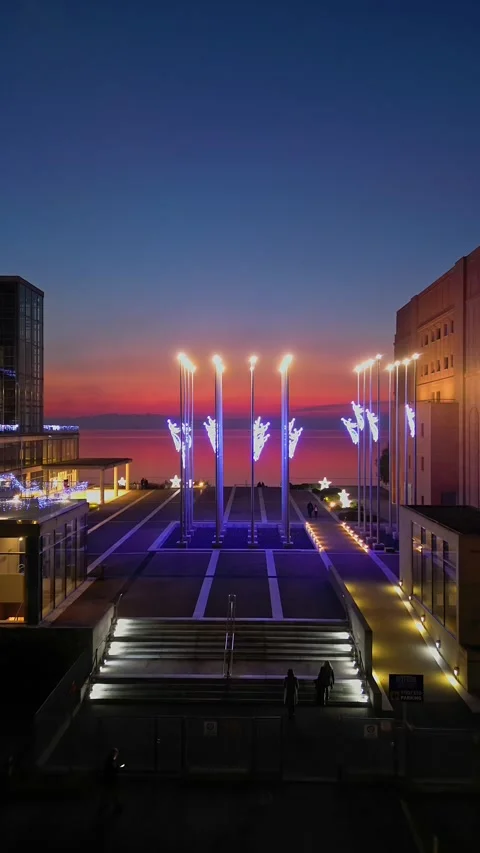 Vertical drone flight over Thessaloniki Concert Hall at sunset Stock Footage 345911632