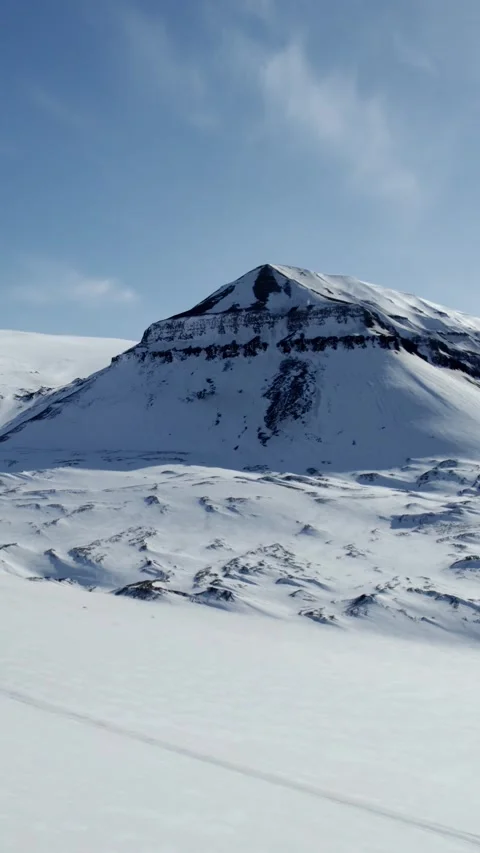 Vertical Drone Flight Past a Pointed Arctic Mountain in Svalbard Stock Footage 340035894