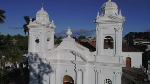 Vertical drone flight showing a white church and Ilobasco town Stock Footage 101448685