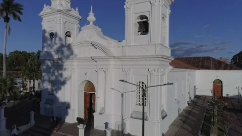 Vertical drone flight showing a white church Stock Footage 101457257