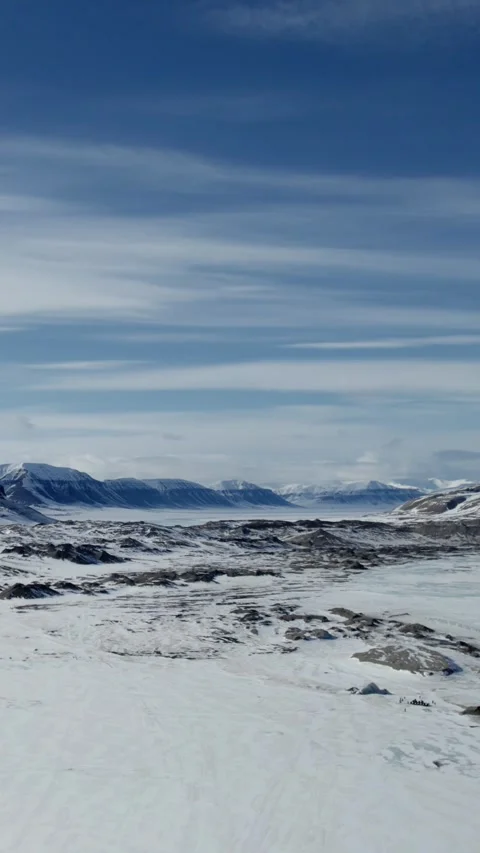 Vertical Drone Flight Through Snowy Arctic Valley in Svalbard Stock Footage 340035824