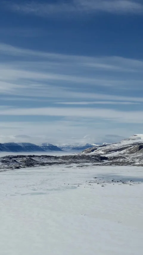 Vertical Drone Flight Through Snowy Arctic Valley in Spitsbergen Stock Footage 340035890