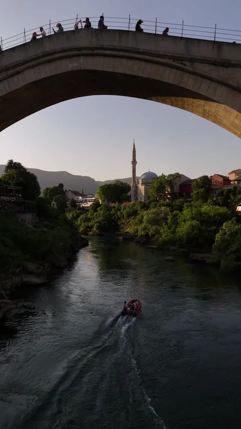 Vertical Drone Fly Back Under Stari Most Bridge with Speed Boat 4K Vídeos de archivo 337831172