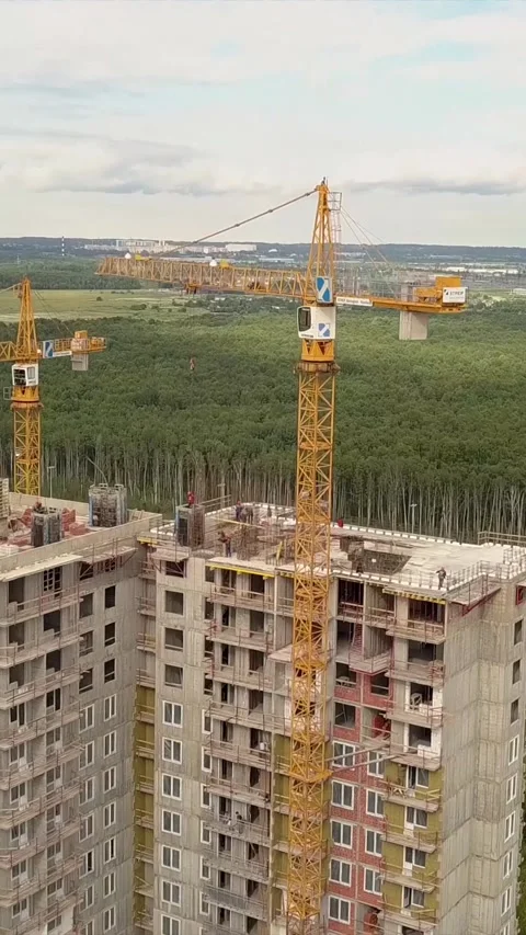 Vertical of Drone fly over construction new modern building work builders and Stock Footage 278487871