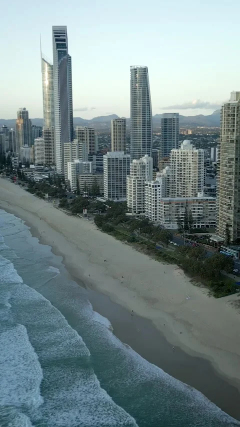 Vertical drone flying along beach Surfers Paradise early morning Gold Coast Vidéo 329005277