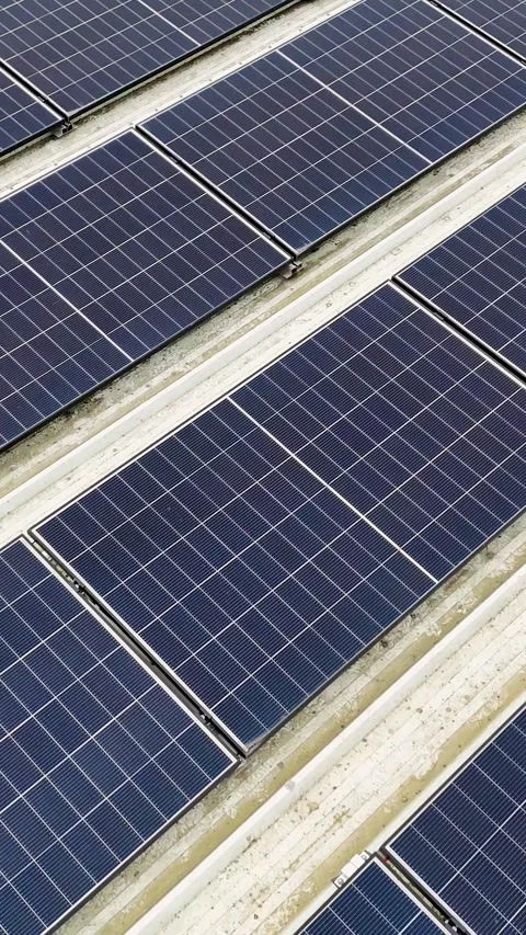 Vertical Drone Flying Backward Over Solar Panels On Corrugated Metal Roof Stock Footage 330750952