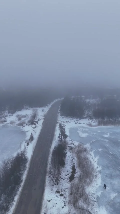 Vertical Drone Flying Backward Over Frozen Quarry Road  Stock Footage 340532982