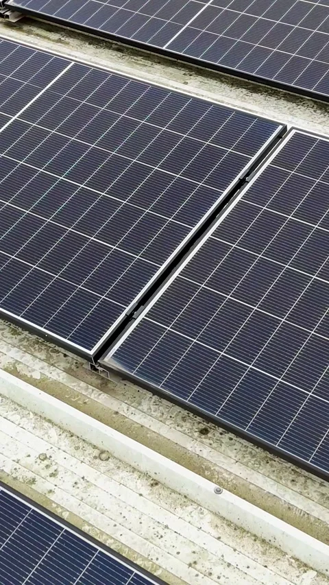 Vertical Drone Flying Forward Over Solar Panels On Corrugated Metal Roof Stock Footage 330750946