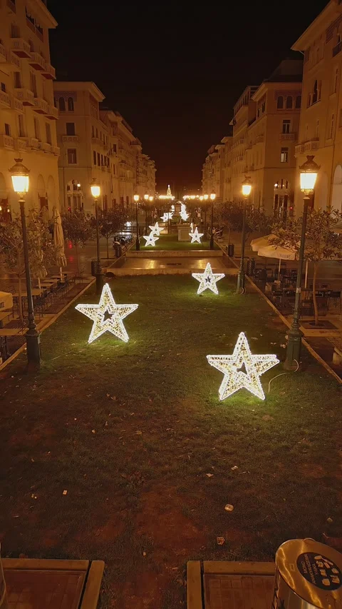 Vertical drone flying over glowing stars on Aristotelous Stock Footage 345908336
