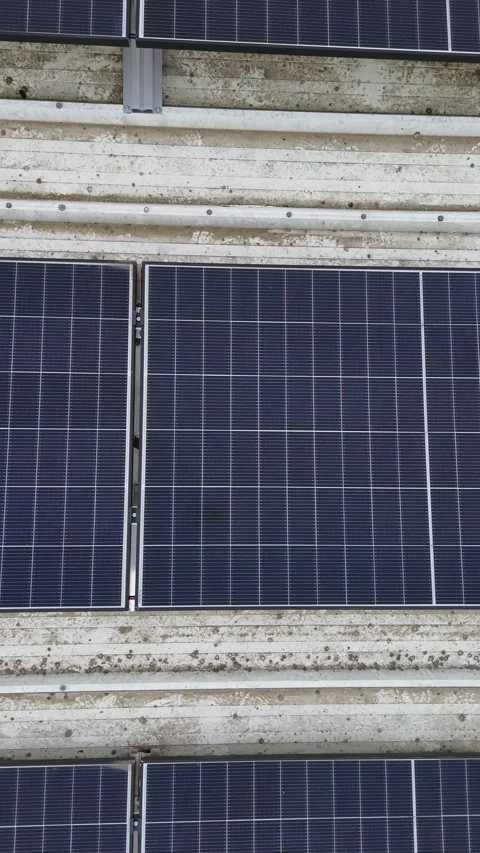 Vertical Drone Flying Sideways Over Solar Panels On Corrugated Metal Roof Stock Footage 330750414