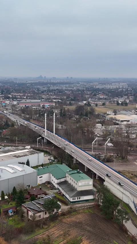 Vertical Drone Flying Sideways Over City Outskirts, Highway And Warehouses Stock Footage 330751218