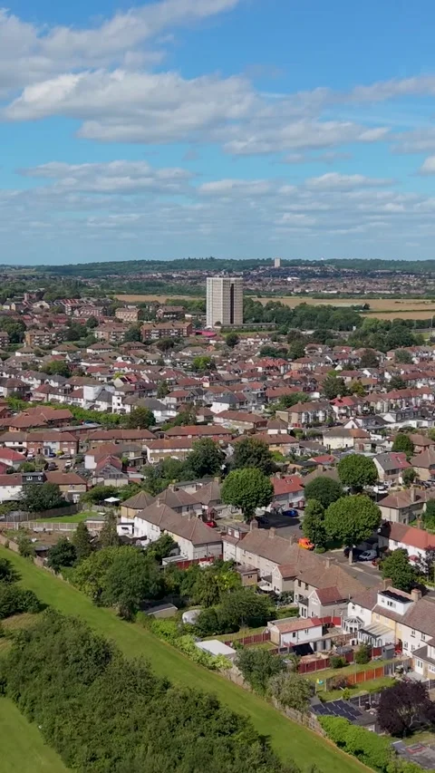 Vertical drone flyover of Chad Park toward Highview House tower block near the Stock Footage 337799379