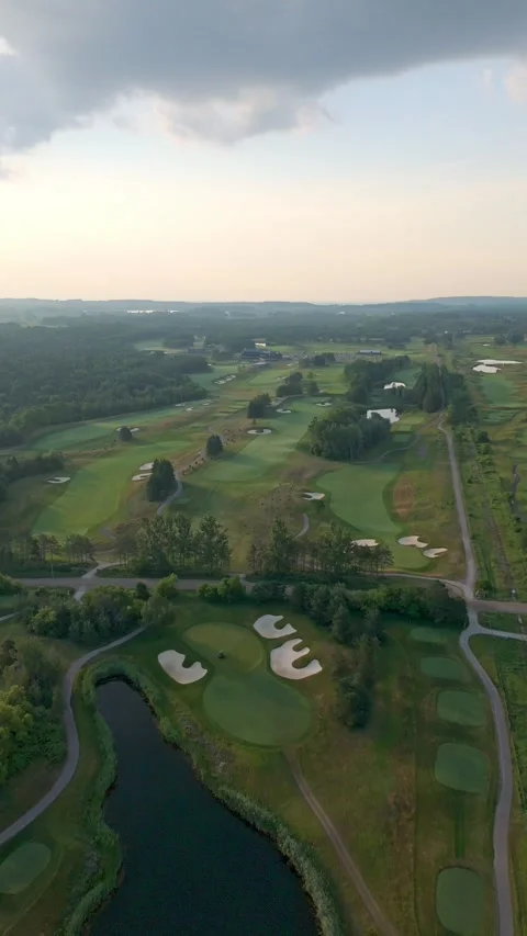 Vertical Drone Flyover Of TPC Toronto At Osprey Valley Golf Course At Sunrise Stock Footage 327390019