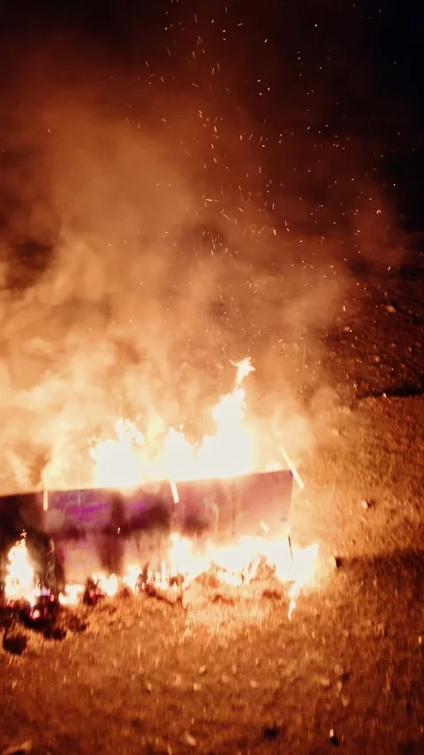 Vertical Drone Flythrough: Sparks of Fire and Watching Crowd at night in forest Stock Footage 294076228