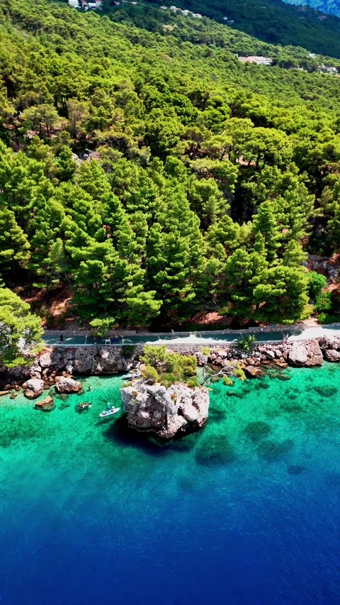 Vertical Drone Footage of Brela Rock in Turquoise Water, Croatia Stock Footage 314389123