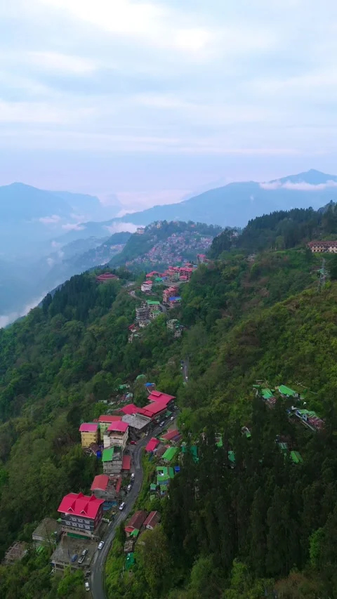 Vertical Drone footage capturing the serene beauty of Gangtok beneath the Stock Footage 311388285