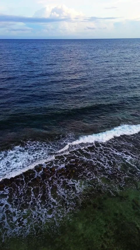 Vertical Drone Footage of dark blue ocean waves Video stock 277403907