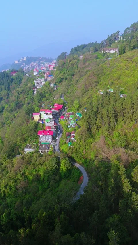 Vertical Drone footage flying over Gangtok’s busy and scenic areas. Stock Footage 311388515