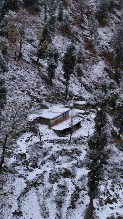 Vertical drone footage of isolated nomadic houses along Mughal Road, abandoned Stock Footage 311151259