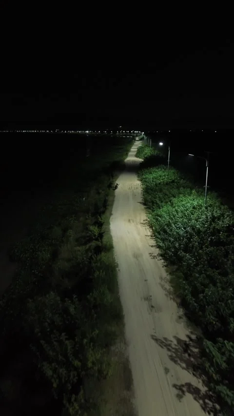 Vertical Drone Footage of Road in the Middle of the Lake at Night Video stock 262850342