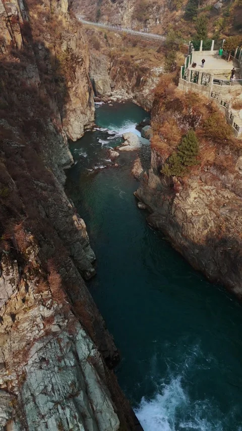 Vertical drone footage top-down view of the thunderous plunge of Aharbal, Stock Footage 311152374