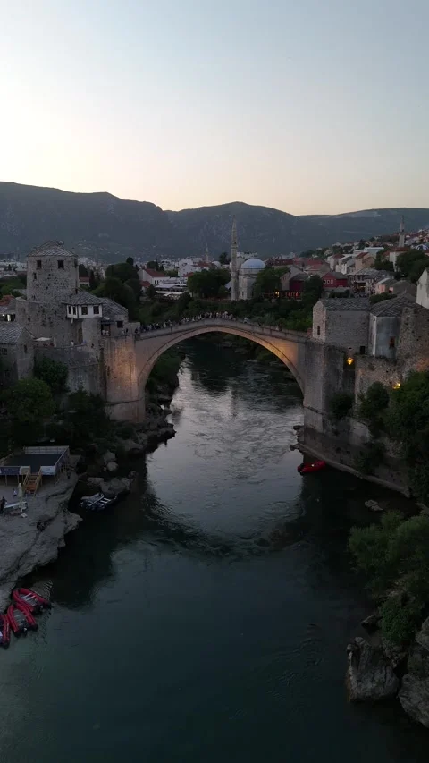Vertical Drone Forward Tracking Shot Over River to Mostar Old Bridge 4K Stock Footage 337830932