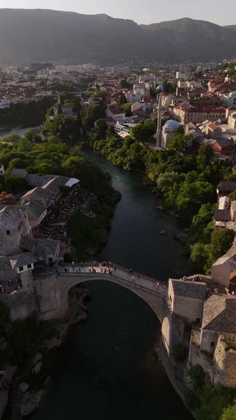 Vertical Drone Forward Tracking Shot and Tilt Down Mostar Old Bridge 4K Stock Footage 337831020