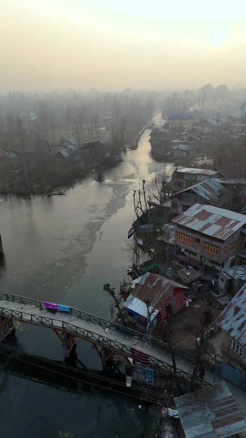 Vertical drone glimpse of the still and silent Dal Lake, frozen at the center of Stock Footage 311020351