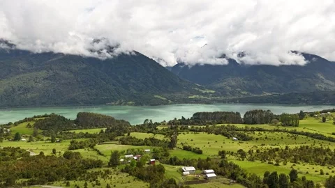 Vertical Drone Hyperlapse Over Lush Forest Toward Fjord with Fast Moving Clouds 스톡 동영상 332816653