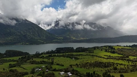 Vertical Drone Hyperlapse Turning Over Mountain Forest Toward Fjord and Clouds 스톡 동영상 332816636