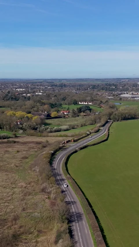 Vertical drone left pan of London Road near Hertford Heath, Hertfordshire UK 스톡 동영상 332619654