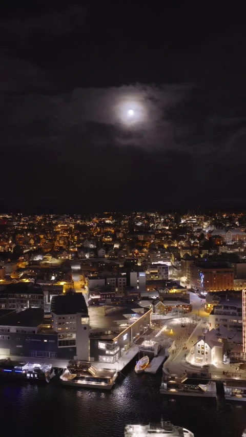 Vertical Drone of Moon and City in Norway Видео 338401605