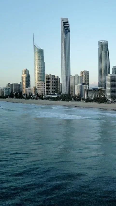 Vertical drone ocean waves rolling surfer wave riding skyline background Stock Footage 329005316