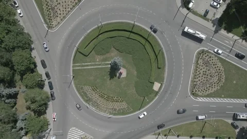 Vertical Drone Orbit Above Urban Traffic Circle With Moving Vehicles Vidéo 341768059