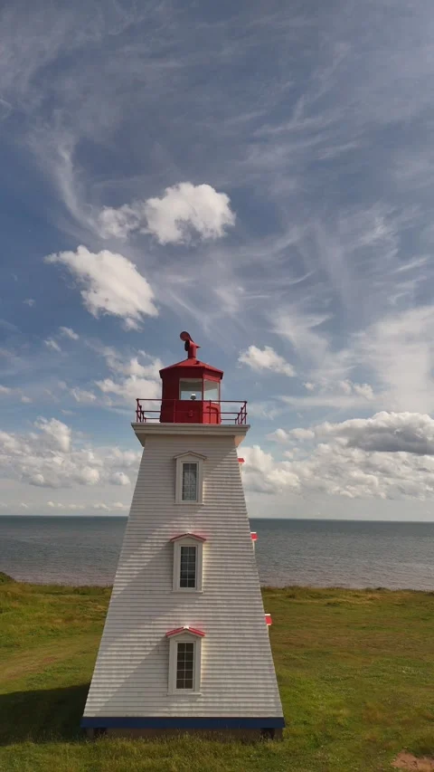 Vertical Drone Orbit Around Cape Egmont Lighthouse, PEI Blue Sky Stock Footage 341363125