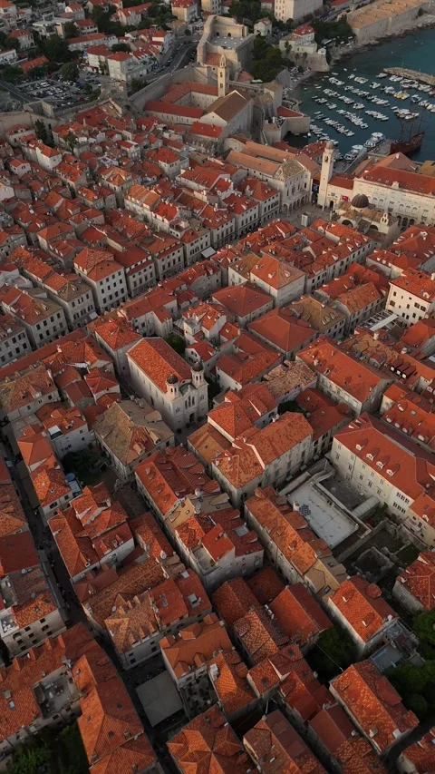 Vertical Drone Orbit Left Looking Down on Dubrovnik Old Town Roofs Dusk 4K Stock Footage 337850317