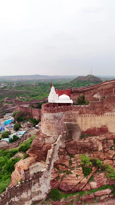 Vertical drone orbit showing walls and tempe of jodhpur fort. Stock Footage 310660823