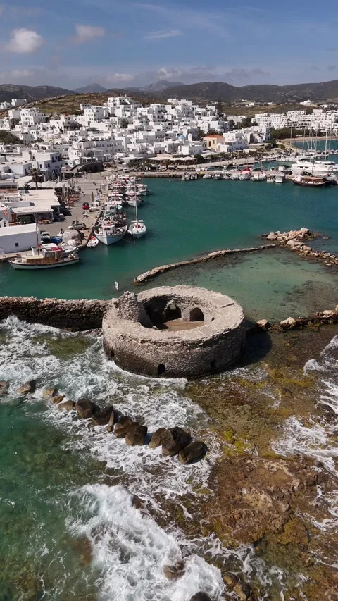 Vertical Drone Orbit of Venetian Castle Ruins in Naoussa Harbor Paros, 4K Stock Footage 337175656